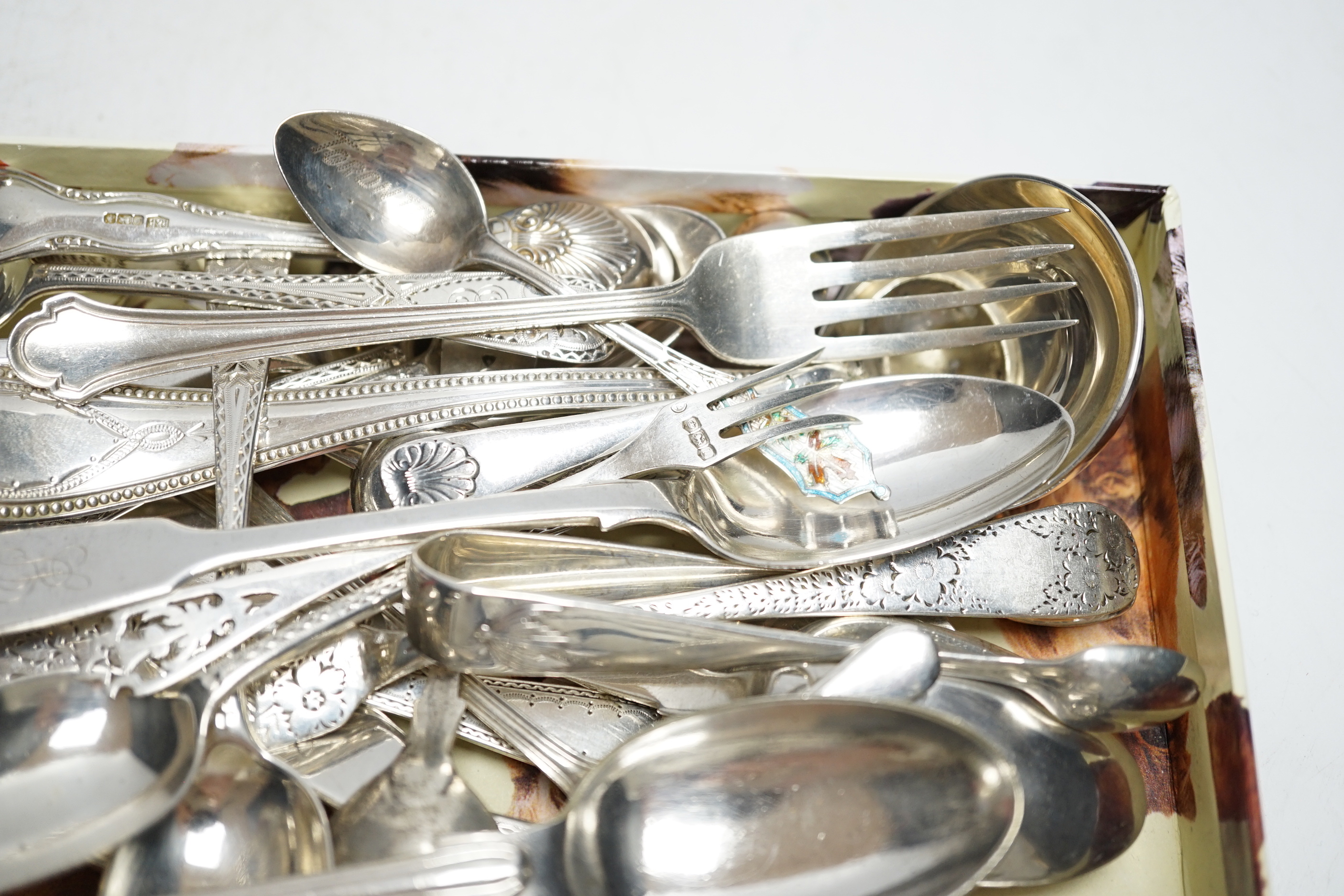 Sundry silver cutlery, including a butter knife, teaspoons, condiment spoons, sauce ladles, etc.